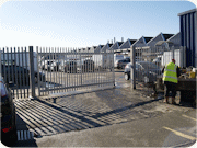 Bolton Industrial Fencing installing steel palisade fencing and a large steel palisade gate at a site in Trafford Park Manchester.