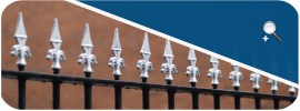 Vertical bar metal railings (iron railings, steel railings) with finials.